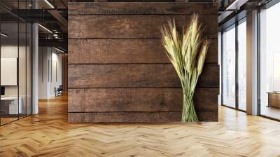 Ears of rye on rustic wooden table. Top view Wall mural