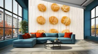 Baked buns on a wooden board, homemade bakery Wall mural