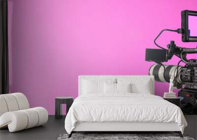 video camera on lighty pink background with bokeh, movie or television broadcasting banner	
 Wall mural