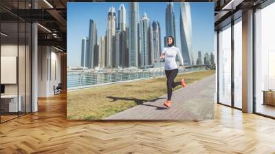 Arabic woman runner, making some urban running Wall mural