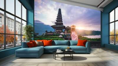 Beautiful girl visiting the ulun danu bratan temple in Bali. Concept about exotic lifestyle wanderlust traveling Wall mural