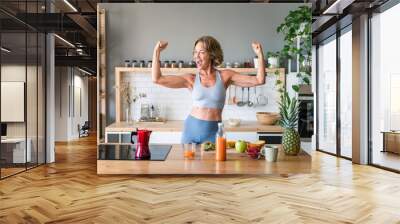 Beautiful mature senior woman at home - Cheerful active mature female person doing fitness training in her apartment, concept about domestic life, healthy lifestyle, dieting and quality of life Wall mural