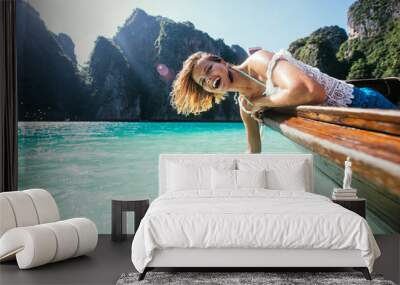 Beautiful woman making an excursion to phi phi island and maya beach in Thailand Wall mural