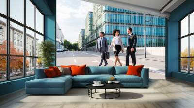 Business people meeting in a business park - International multiethnic business team walking on the street in the city Wall mural