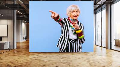 Cool and stylish senior old woman with fashionable clothes - Funny colorful portrait of elderly female lady on colored background Wall mural