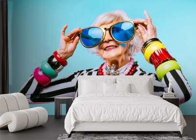 Cool and stylish senior old woman with fashionable clothes Wall mural