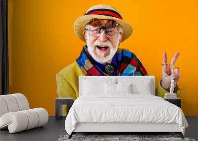 Cool senior man with fashionable outfit portrait - Funny old male person with cool and playful attitude on colorful background Wall mural