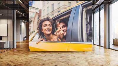 Couple on a taxi in Manhattan Wall mural