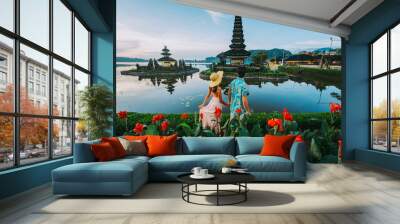 Couple spending time at the ulun datu bratan temple in Bali. Concept about exotic lifestyle wanderlust traveling Wall mural