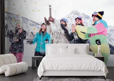 Friends playing on the mountains, celebrating and having fun Wall mural