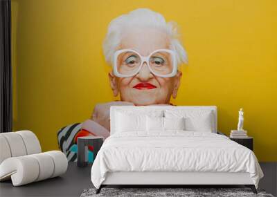 Funny grandmother portraits. Senior old woman dressing elegant for a special event. granny fashion model on colored backgrounds Wall mural