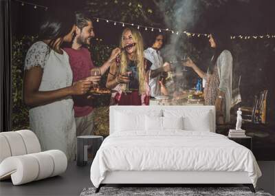 Group of friends making barbecue in the backyard at dinner time Wall mural