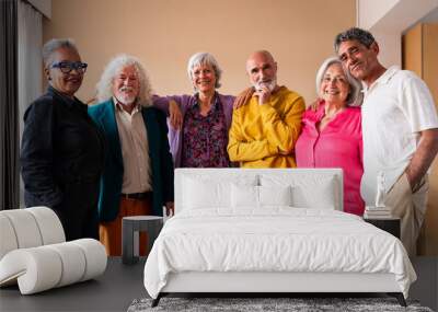 Group of happy senior friends bonding at home for dinner party - Cheerful and youthful old mature multiethnic people having fun Wall mural