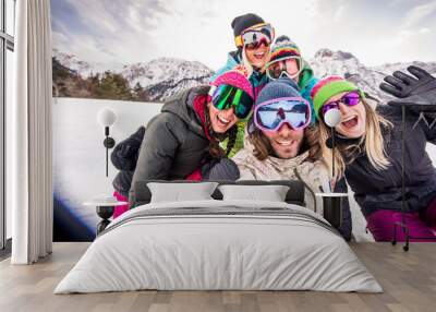 Group of snowboarders on winter holiday Wall mural