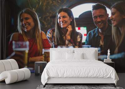 Group of teens having fun in a pub Wall mural