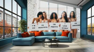 Group of women with different body and ethnicity posing together to show the woman power and strength. Curvy and skinny kind of female body concept Wall mural