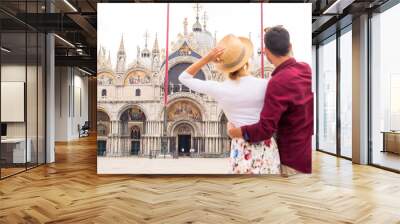 Happy cheerful young ouple travelling in Venice, Italy - Tourists visiting the historic city of Venice Wall mural