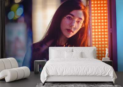 Pretty asian woman portrait with led lights Wall mural