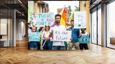 Public demonstration on the street against global warming and pollution. Group of multiethnic people making protest about climate change and plastic problems in the oceans Wall mural