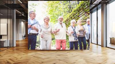 Senior people walking outdoors Wall mural