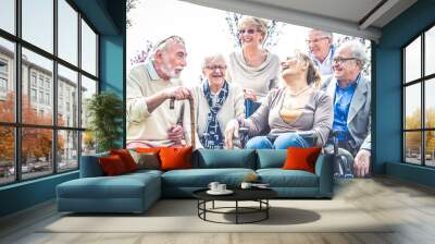 Senior people walking outdoors Wall mural