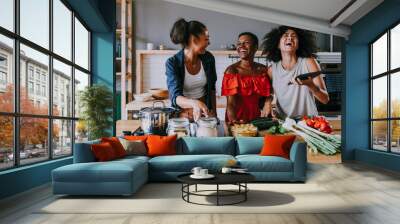 Three mixed race hispanic and black women bonding at home - Multiracial group of happy young female adults spending time together and having fun Wall mural