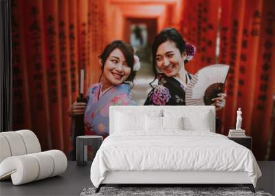 Two japanese girls wearing kimonos traditional clothes, lifestyle moments Wall mural