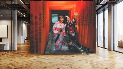 Two japanese girls wearing kimonos traditional clothes, lifestyle moments Wall mural