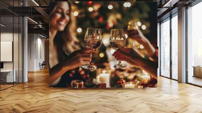 Women's hands toasting with a glass of wine. Wall mural