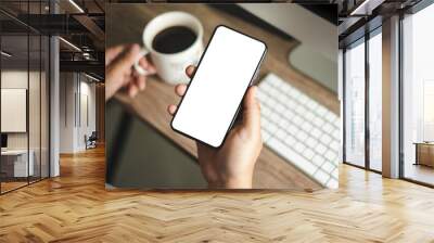 Top view Mockup image hand using a smartphone man Holding Cell Phone With Blank Screen Wall mural