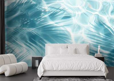 The image captures the serene patterns of light underwater with shadows of tropical leaves Wall mural