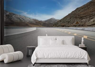 Empty highways and distant mountains Wall mural