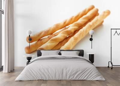 a bunch of breadsticks sitting on top of a white surface Wall mural