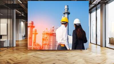 woman engineer and men engineer work new project in power plant Wall mural