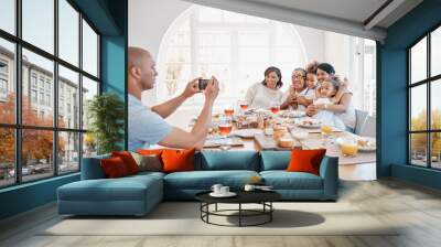 Home, man and family with photography for dinner with smile for thanksgiving, gathering and reunion. People, generations and happy with food in table for memories, fun and social media with bonding Wall mural