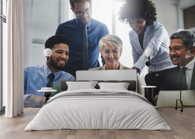 look, we pop up first in the search engine. shot of a group of businesspeople working together on a  Wall mural