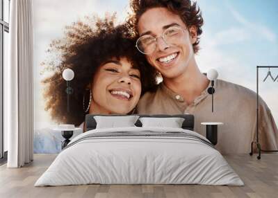 Portrait of a young mixed race couple enjoying a day at the beach looking happy and in love. Portrait of a young mixed race couple enjoying a day at the beach looking happy and in love. Wall mural