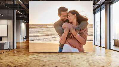 Young diverse biracial couple having fun at the beach together. Young diverse biracial couple having fun at the beach together. Wall mural