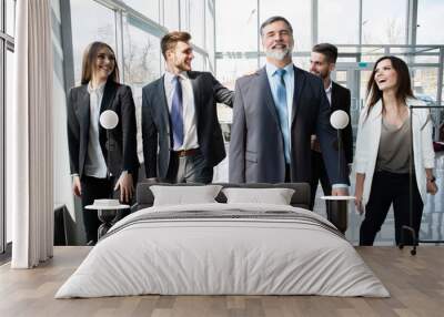 Business People Team Walking In Modern Office, Confident Businessmen And Businesswomen In Suits Diverse With Mature Leader In Foreground. Wall mural