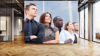 business team standing in a row at office and looking upwards - Successful business team. Wall mural