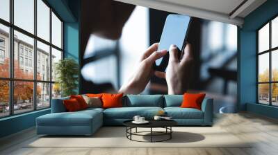 business woman using smartphone during lunch in cafe. Wall mural