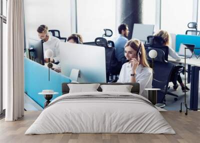 Colleagues working in a call center. Wall mural