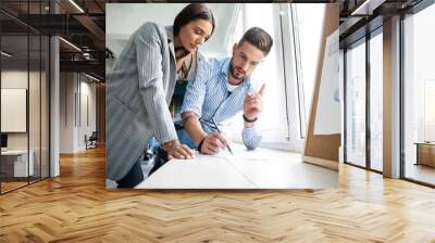 Coworkers team picture in modern office. Project managers work new idea Wall mural