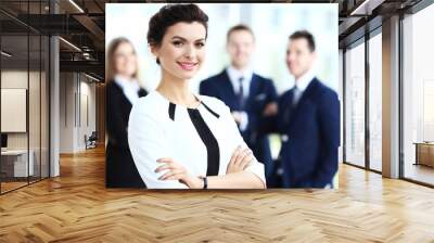 Face of beautiful woman on the background of business people Wall mural