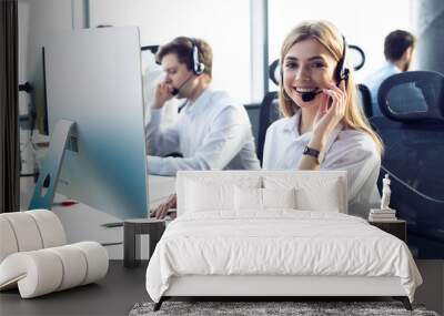 Female customer support operator with headset and smiling Wall mural