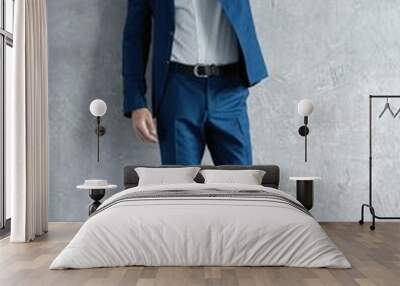 full length of handsome man wear blue suit isolated on grey background Wall mural