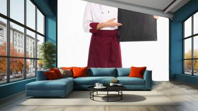 Full length portrait of a cheerful male chef cook in uniform holding blank board isolated on a white background. Wall mural