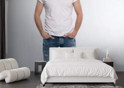 Full length studio portrait of casual young man in jeans and shirt. Isolated on white background. Wall mural