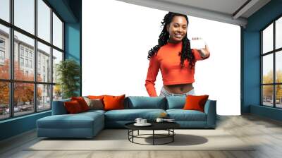 Girl holding a gift card. Young beautiful woman showing copy space on empty blank sign or gift card isolated on transparent background Wall mural