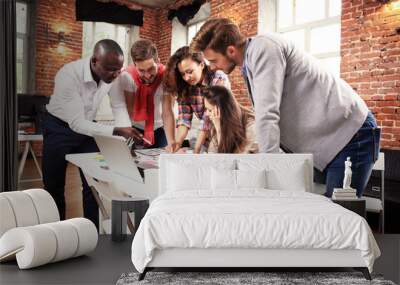 Group of five creative worker brainstorm together in office, new style of workspace, happy scene of people in office Wall mural